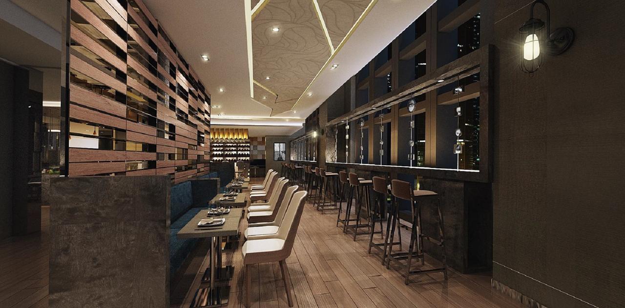 فندق سيزار مترو تايبيه المظهر الخارجي الصورة The photo shows the interior of a modern restaurant. It features a sleek design with wooden accents, including a slatted wood wall. The space is illuminated by ceiling lights and has large windows that offer a view of the outside. There are several d